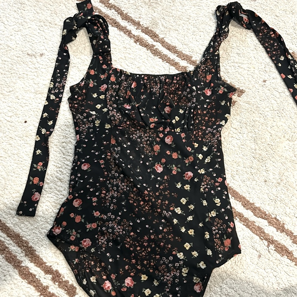 Floral bodysuit with tie detail on straps and ruching on the front